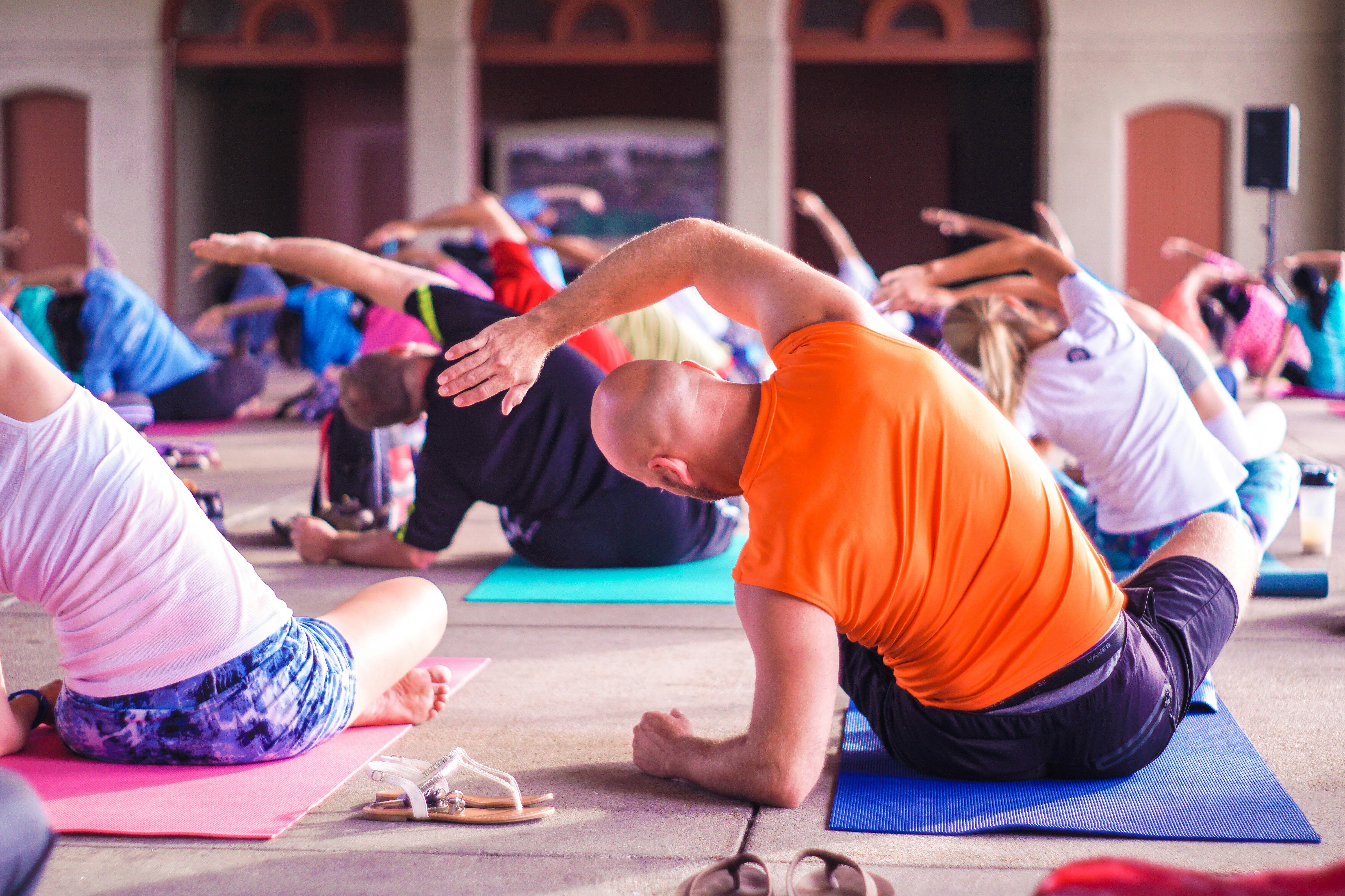 A large group of people during a yoga session
